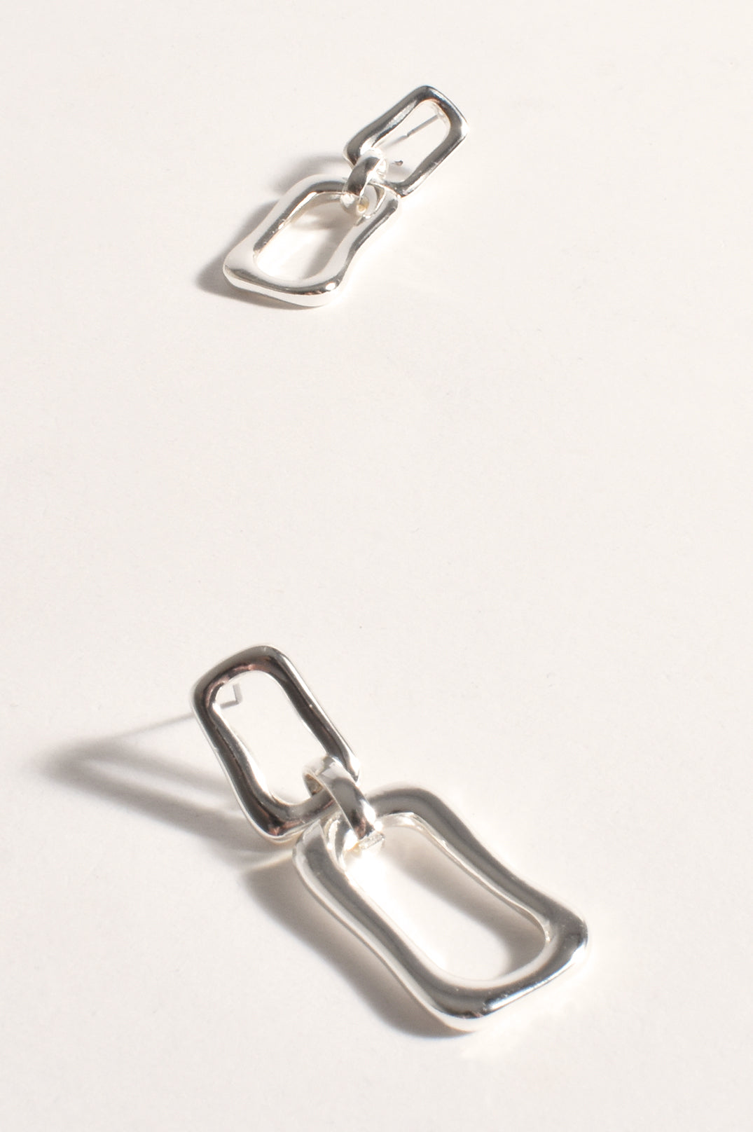 ADORNE CUT OUT GEO SHAPES EARRINGS in SILVER AED3795