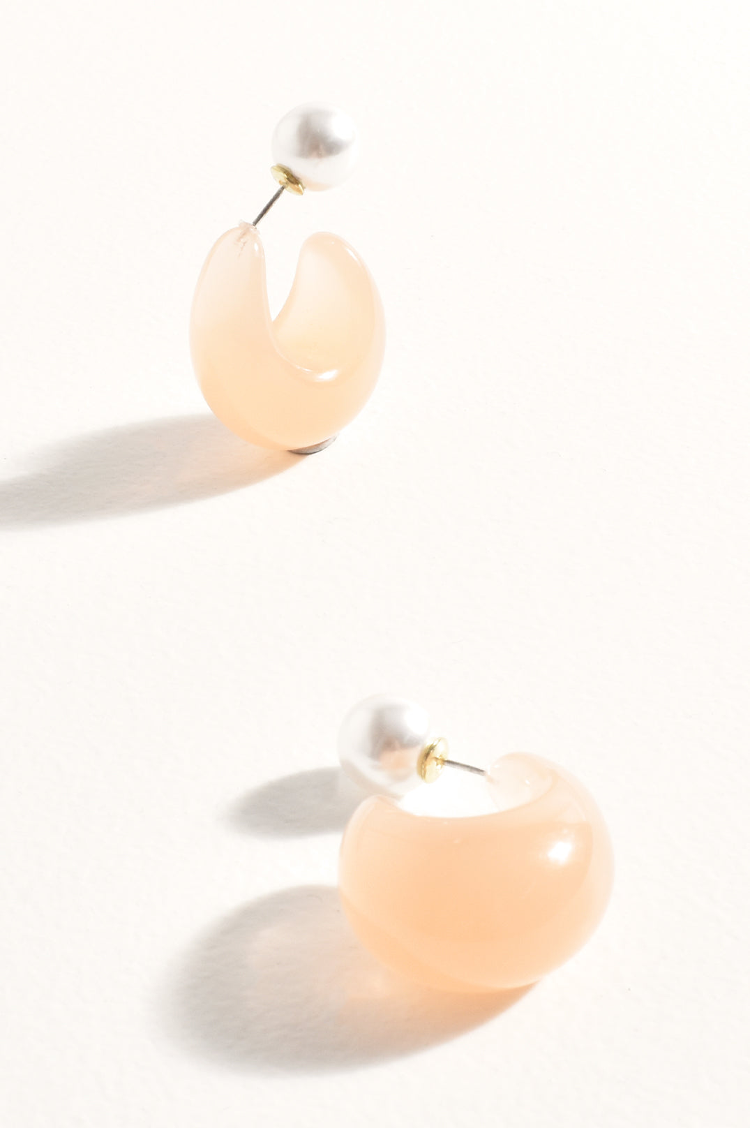Adorne Pearl Back Curved Resin Hoops in Nude AED4111