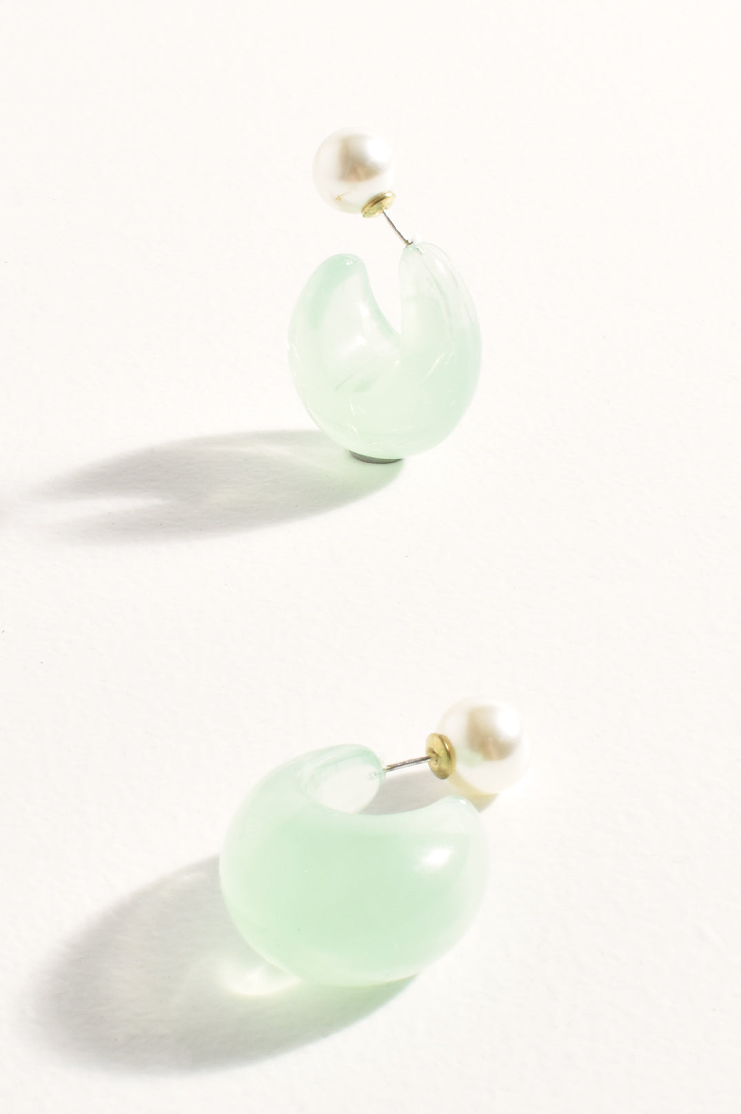 Adorne Pearl Back Curved Resin Hoops in Sage AED4111