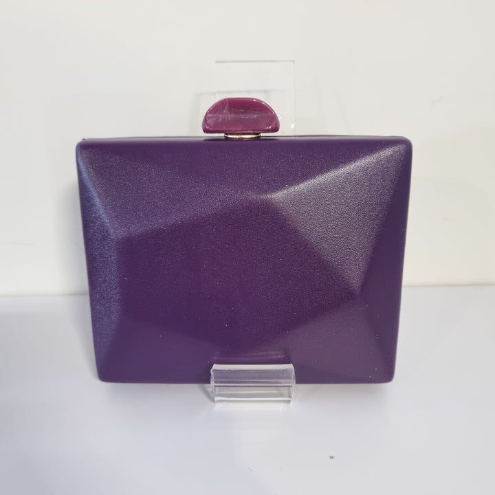 De Cavalier Purple Structured Clutch 854 has a small mark on corner