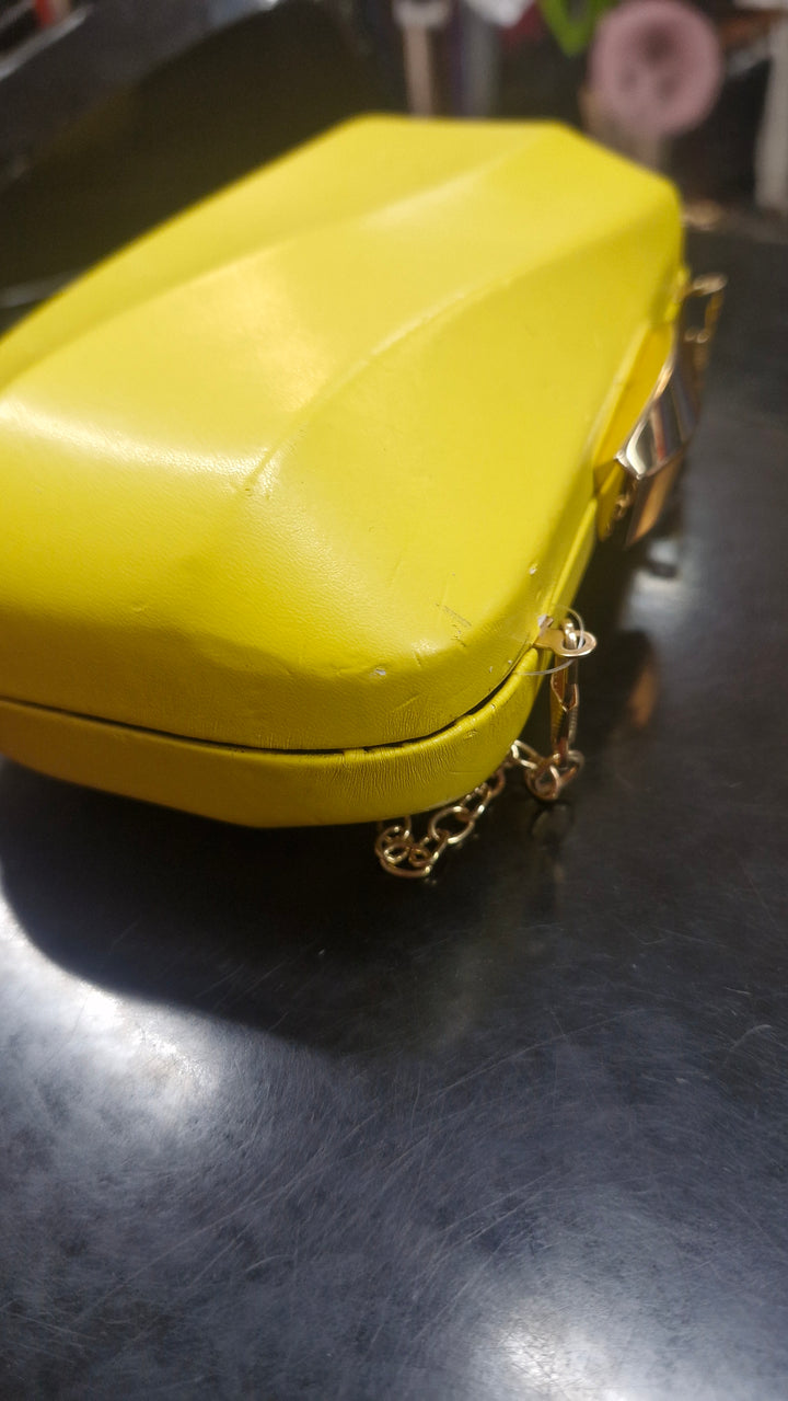 Avah Wave Clutch in Yellow has several marks J861