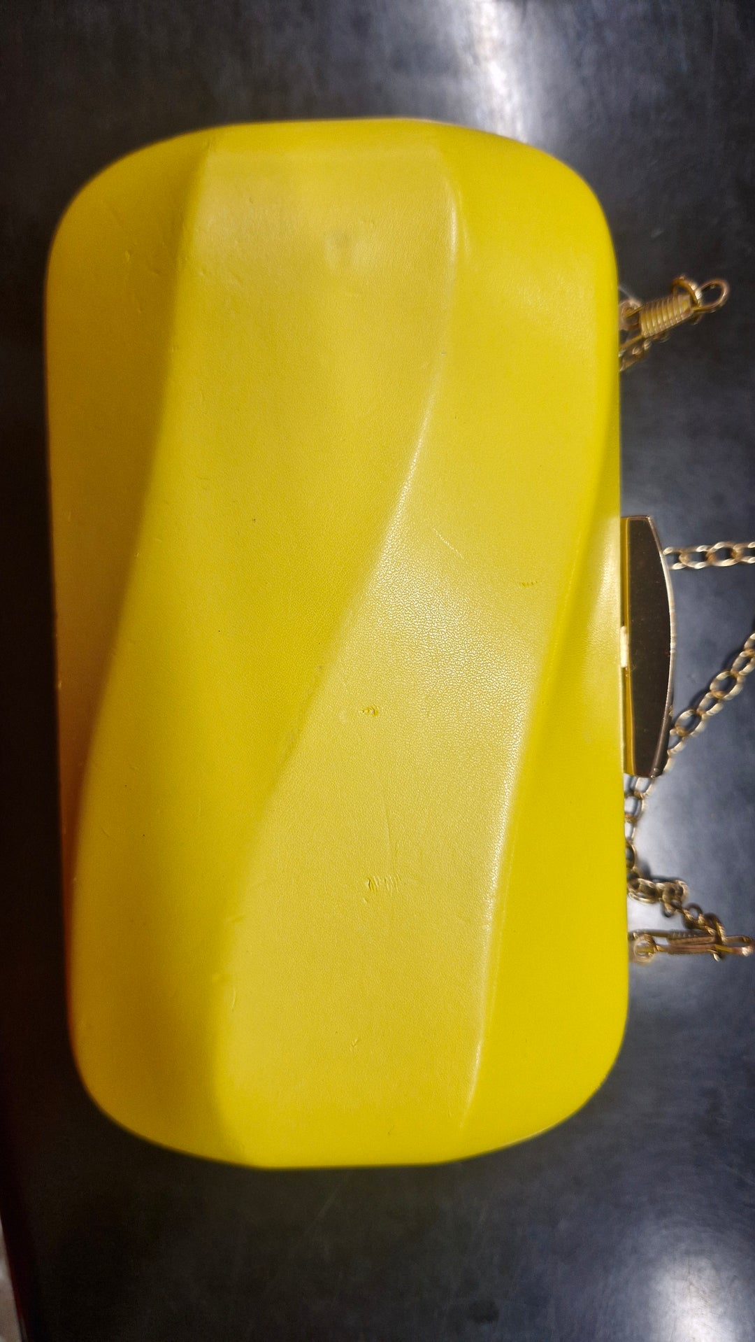 Avah Wave Clutch in Yellow has several marks J861
