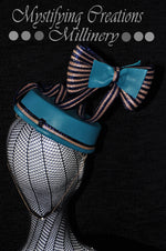 MC Millinery MC1163 Jade leather pillbox with floating navy and latte braid bow